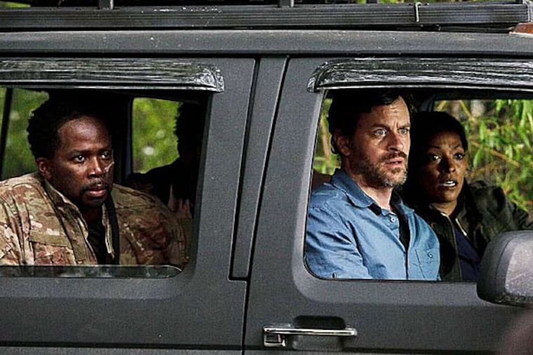 "Z Nation," Harold Perrineau (as Hammond), Tom Everett Scott (Garnett), and Kellita Smith (Warren) are part of the escort group for a man who has withstood many zombie bites without turning. (OLIVER IRWIN / Syfy)
