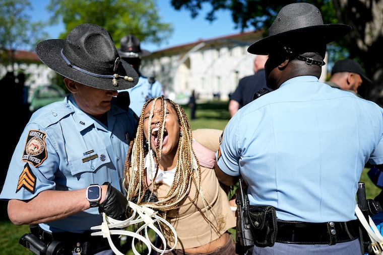 Georgia State Patrol officers detain a demonstrator on the campus of Emory University during a pro-Palestinian demonstration Thursday in Atlanta.