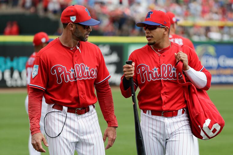 Second baseman Cesar Hernandez (right) and manager Gabe Kapler walking to the Phillies dugout during spring training.