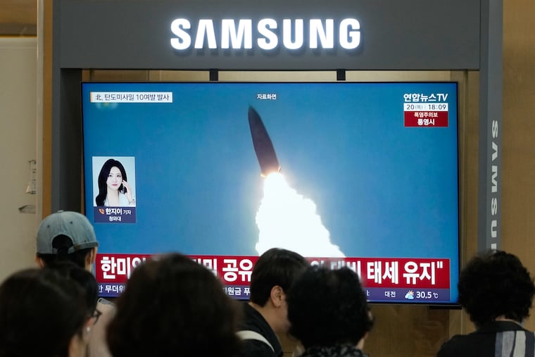 A TV screen shows a file image of North Korea's missile launch during a news program at Seoul Railway Station in Seoul, South Korea on Thursday.