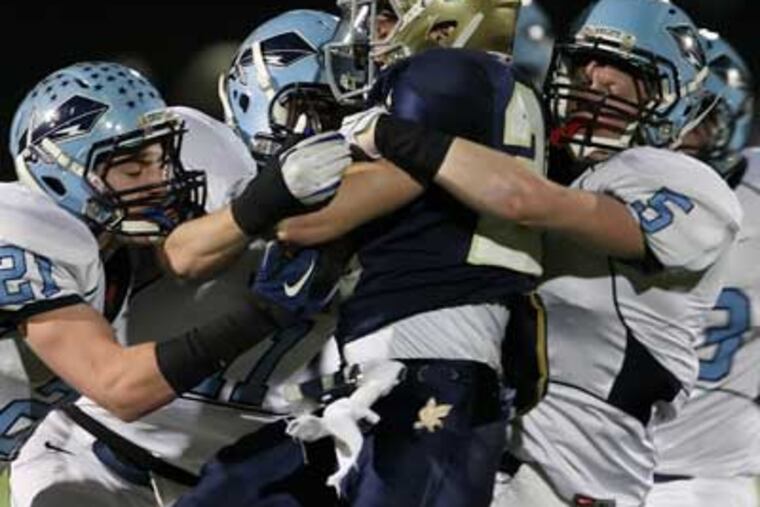 North Penn's defense stops Council Rock South's Anthony Alimenti during the 2nd quarter. (Steven M. Falk /Staff Photographer)