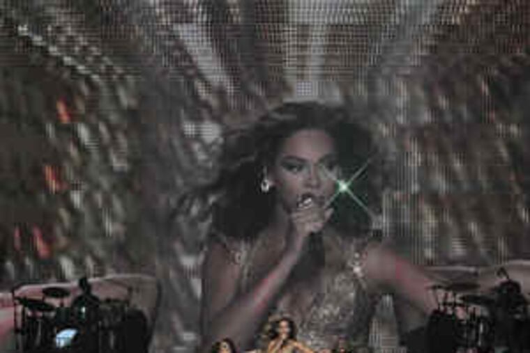 The opening of Beyoncé Knowles' concert Friday at the Wachovia Center, for last year's album "I Am . . . Sasha Fierce." The whole show demonstrated her considerable skills as singer, dancer, bandleader, and - after several quick costume changes - a real clothes horse.