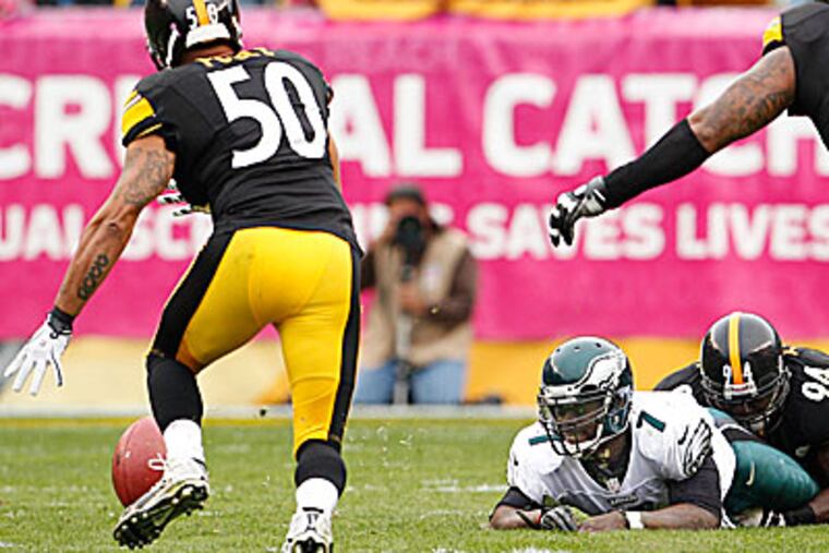 Michael Vick lost two fumbles in the Eagles' 16-14 loss to the Steelers. (Ron Cortes/Staff Photographer)