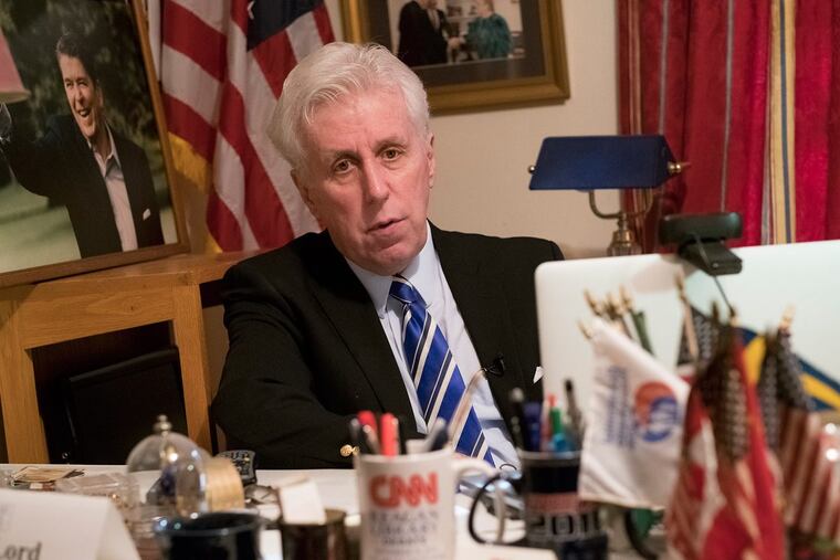 Jeffrey Lord sits in his home office and prepares to record a CNN segment with Anderson Cooper via Skype.
