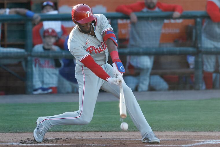 Johan Rojas was batting .171 with three extra-base hits, one walk, and eight strikeouts through Monday. He's pictured hitting a ground ball during Tuesday's spring training game.