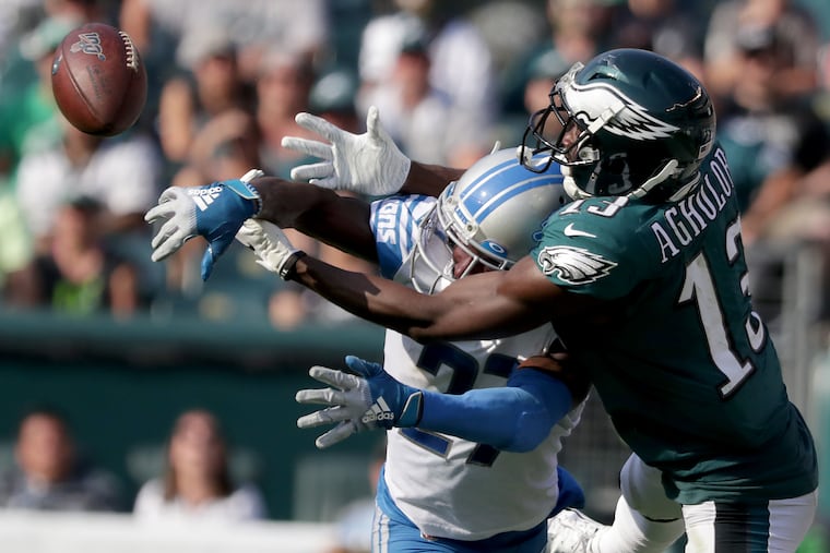 Eagles wide receiver Nelson Agholor, right, tries to catch a pass as Detroit Lions cornerback Justin Coleman, left, defends.