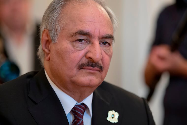 FILE - In this Aug. 14, 2017, file photo, Libyan militia commander General Khalifa Hifter meets with Russian Foreign Minister Sergei Lavrov in Moscow, Russia. Hifter, who once lived in northern Virginia and now commands an army vying for control of his native country, has been accused in a civil lawsuit of war crimes. The lawsuit was filed Wednesday, June 26, 2019, in U.S. District Court in Alexandria by Libyan family members who say their loved ones were killed when forces controlled by Khalifa Hifter conducted bombings in civilian neighborhoods. (AP Photo/Ivan Sekretarev, File)