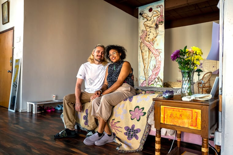 Philadelphia artists Bryce (left) and Calan. The couple is working on "Edwin Eats an Edible" — a children's-style book for adults.