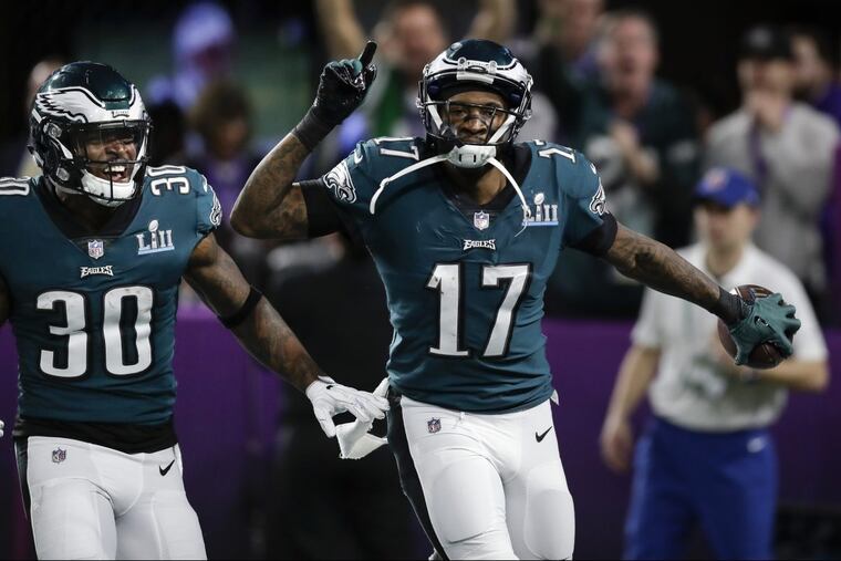 Eagles running back Corey Clement, left, and Eagles wide receiver Alshon Jeffery, right. celebrate Jeffery's touchdown catch at Super Bowl LII, at U.S. Bank Stadium in Minneapolis, Minnesota, Sunday, Feb. 4, 2018. YONG KIM / Staff Photographer.