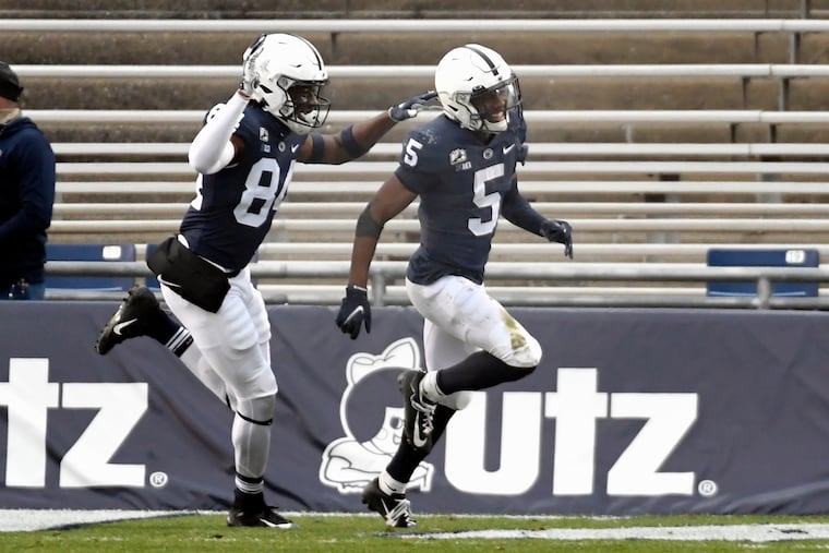 Penn State wide receiver Jahan Dotson (5) celebrates after returning a punt for a touchdown during the third quarter of NCAA college football game against Michigan State in State College, Pa., on Saturday.