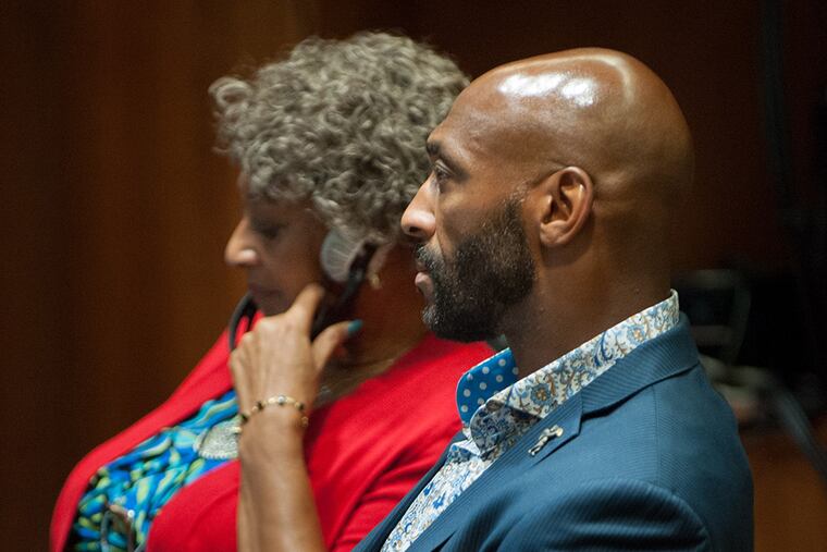 Former Eagle Irving Fryar sits next to his mother, Allene McGhee, during testimony in his case at the Burlington County Courthouse in Mount Holly on Wednesday, July 29, 2015. (TRACIE VAN AUKEN/ For The Inquirer)