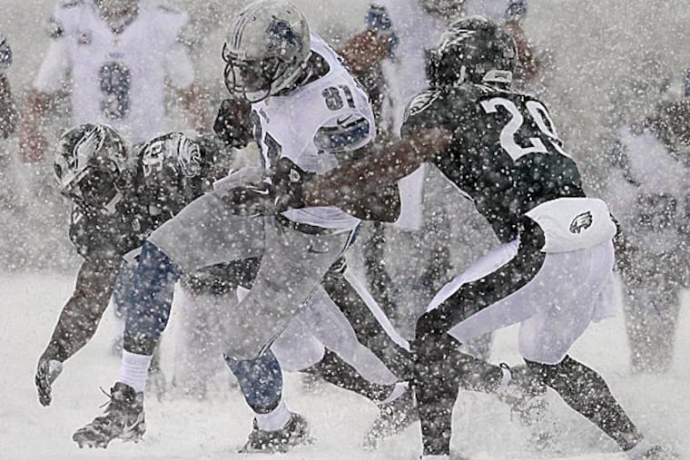 The Eagles' Nate Allen and DeMeco Ryans tackle the Lions' Calvin Johnson. (David Maialetti/Staff Photographer)