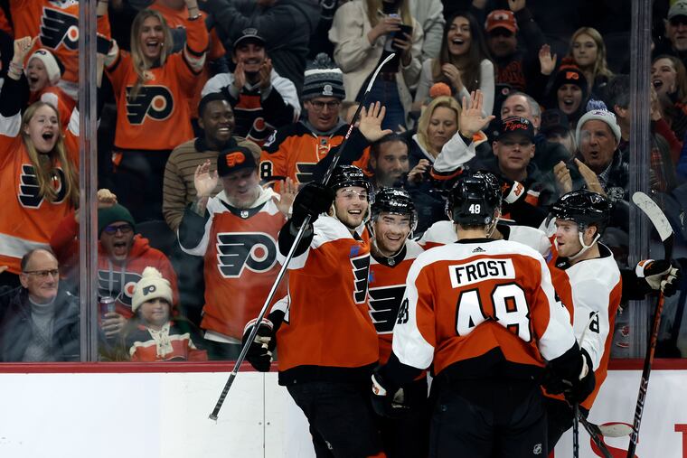 Flyers # 26 Sean Walker (second from left) celebrates his first period goal on Jan. 18.