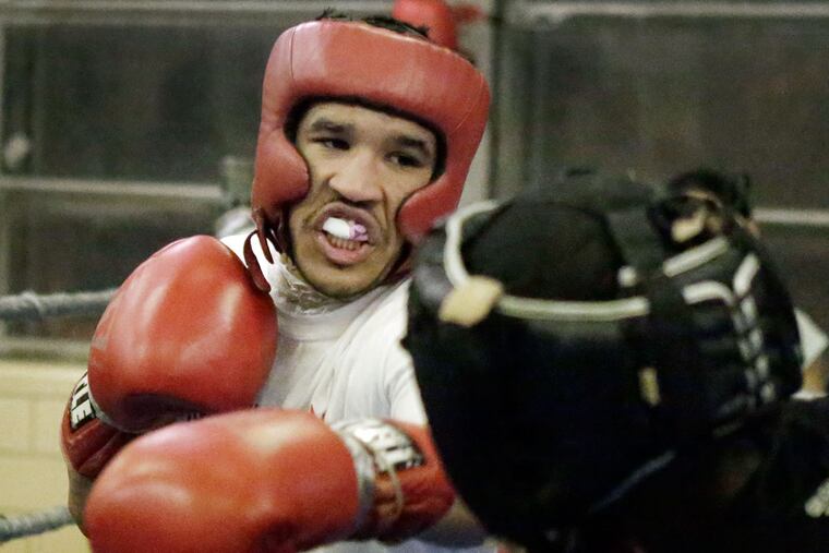 Paul Kroll tunes up with Robert Piugese at the Rivera Recreation Center.