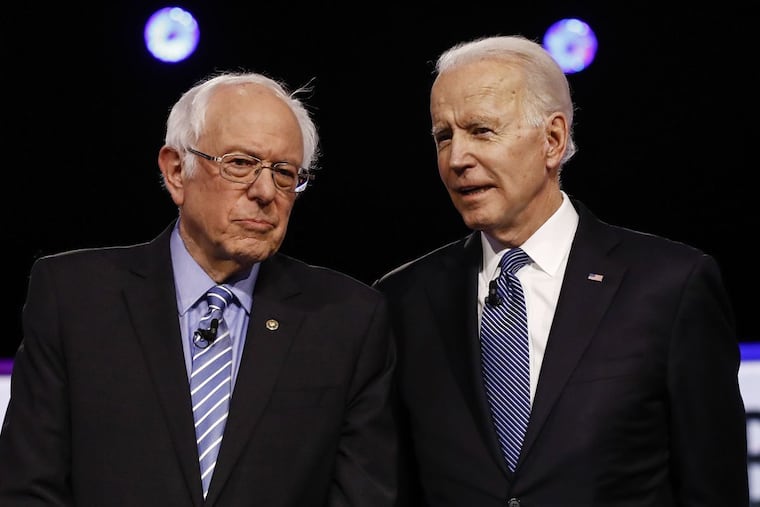 Democratic presidential candidates Sen. Bernie Sanders (left) and former Vice President Joe Biden during the South Carolina debate on Feb. 25, 2020 in Charleston, S.C.