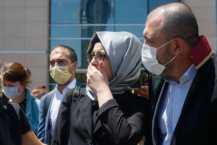 Hatice Cengiz, the fiancee of slain Saudi journalist Jamal Kashoggi, leaves a court in Istanbul, Friday, July 3, 2020, where the trial in absentia of two former aides of Saudi Crown Prince Mohammed bin Salman and 18 other Saudi nationals over the 2018 killing of the Washington Post columnist had began. Turkish prosecutors have indicted the 20 Saudi nationals over Khashoggi's grisly killing at the Saudi Consulate in Istanbul that cast a cloud of suspicion over Prince Mohammed and are seeking life prison terms for defendants who have all left Turkey. Saudi Arabia rejected Turkish demands for the suspects' extradition and put them on trial in Riyadh.