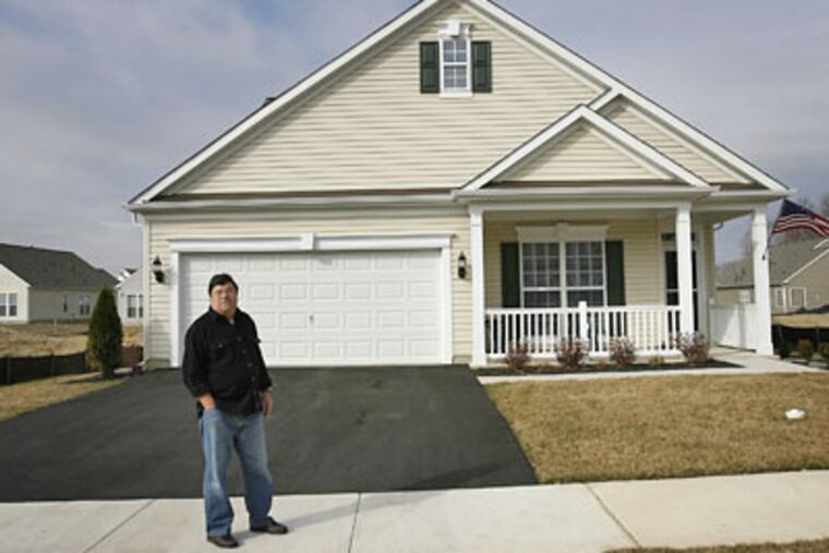Dana Nasuti stands in front of his home in Newark, Del. The house was recently refinanced for a lower interest rate and the loan amount did not reflect the money he spent adding a home office. (Michael S. Wirtz / Staff Photographer)