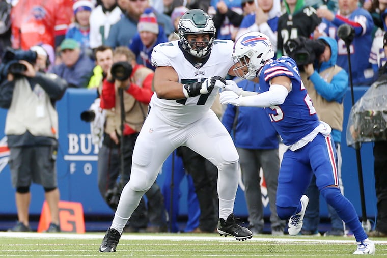 Eagles tackle Andre Dillard (77) blocks Bills safety Micah Hyde.