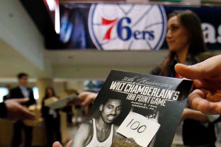 Fans at the Wells Fargo Center received a mounted 2-inch square of the original Hershey, Pa., court on which Wilt Chamberlain scored 100 points. The handout was on March 2, 2012, the 50th anniversary of the record-setting performance.