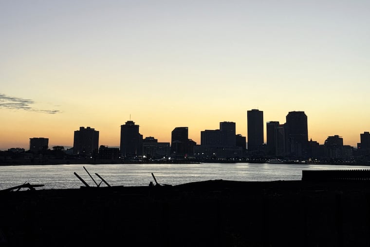 The view of a sunset from New Orleans’s Crescent Park, where a bronze statue is dedicated to the Latin American workers who helped rebuild after Hurricane Katrina. MUST CREDIT: Arelis R. Hernández/The Washington Post