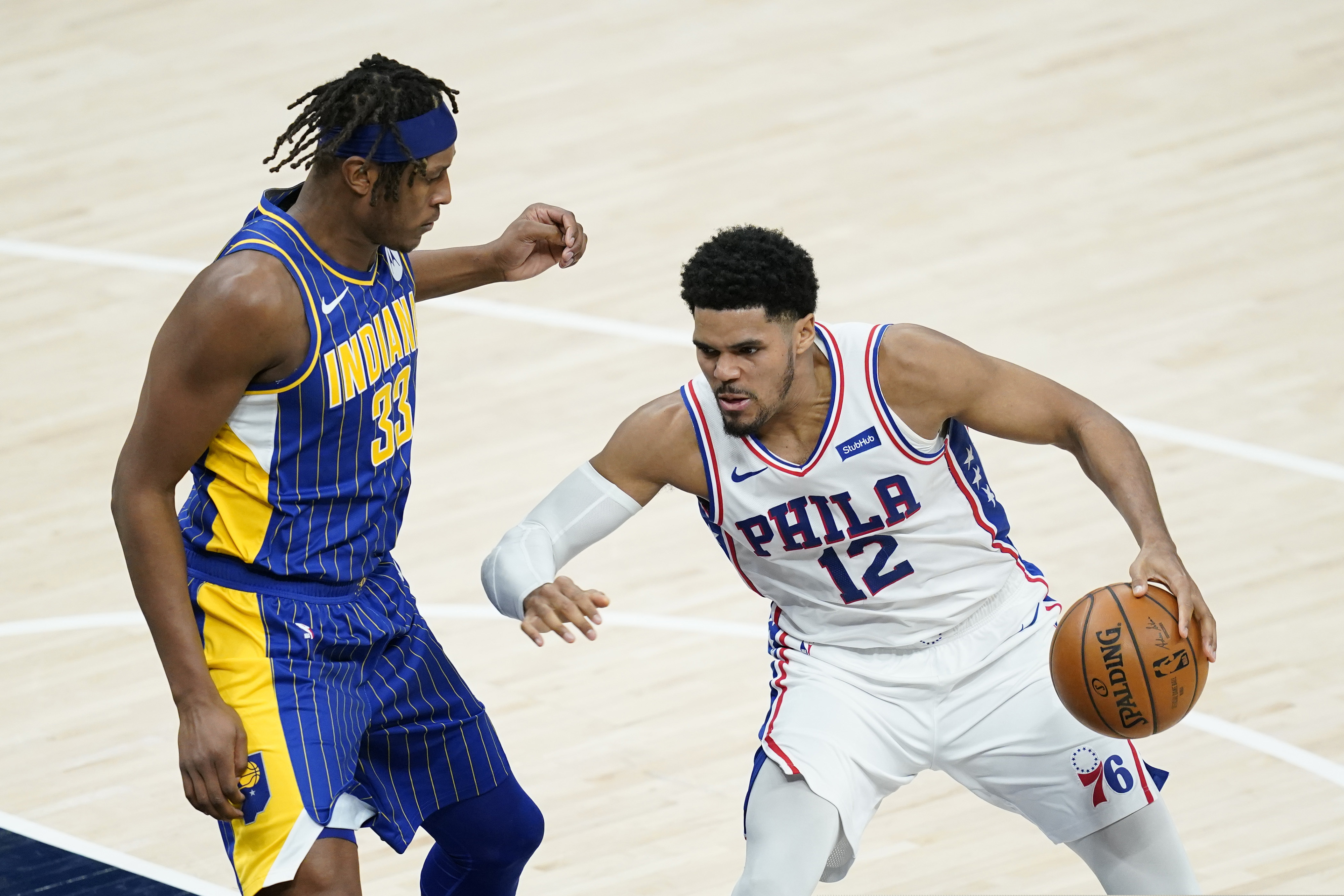 Tobias Harris is defended by the Pacers' Myles Turner in the second half.