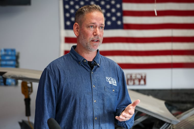 Dan Osborn, an independent candidate for U.S. Senate in Nebraska, speaks with reporters during a news conference at his home in Omaha in May 2024.