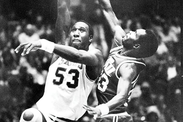 Darryl Dawkins (left) shoots past James McElroy in 1978. Dawkins was so mad after a playoff win (yes, win) over Portland that he ripped a toilet off the floor.