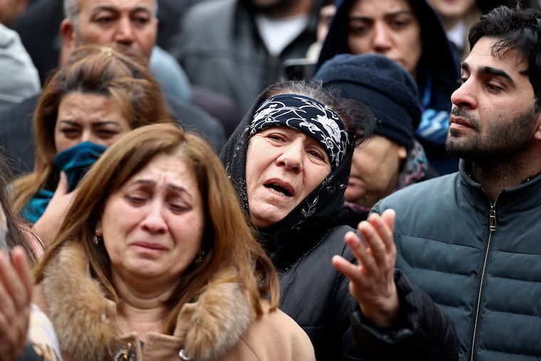 People mourn during a funeral of the crew members of the Azerbaijan Airlines Embraer 190 killed in a deadly plane crash in Kazakhstan last week.