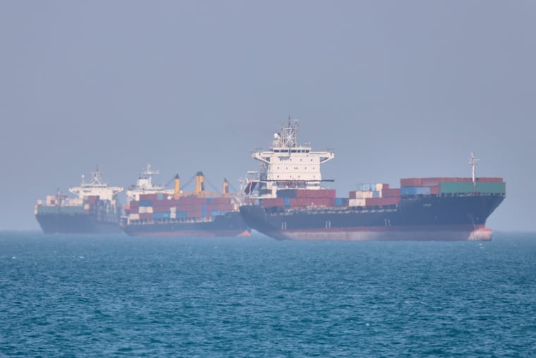 Container ships sit at anchor in the Strait of Hormuz off Bandar Abbas, Iran, Saturday, May 2, 2026.