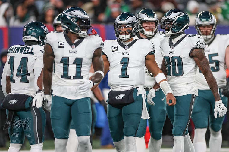 Eagles quarterback Jalen Hurts (1) takes the field with the offense including wide receiver A.J. Brown (11) in the first half against the New York Giants at MetLife Stadium.
