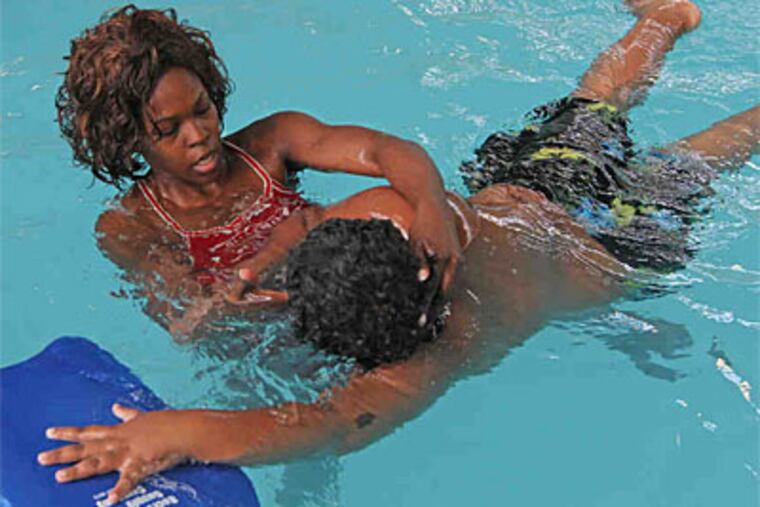 Doris Swarn leads a swim class at the Hartranft pool. "It's awesome the way Doris works her program," says one community leader. "Whatever is going on in that pool, Doris is on it." (Michael Bryant / Staff Photographer)