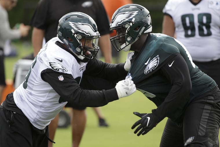 Philadelphia Eagles defensive end Derek Barnett, left, and offensive guard Dillon Gordon battle during training camp.