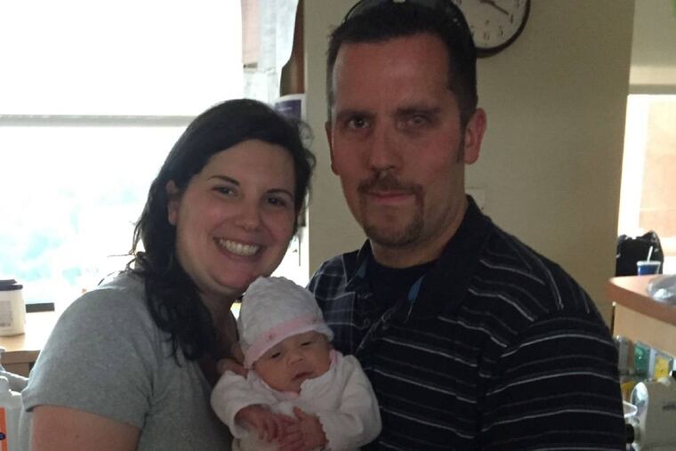 Parents Audrey Fanucci and John Goddard with their miracle-daughter, Grace.