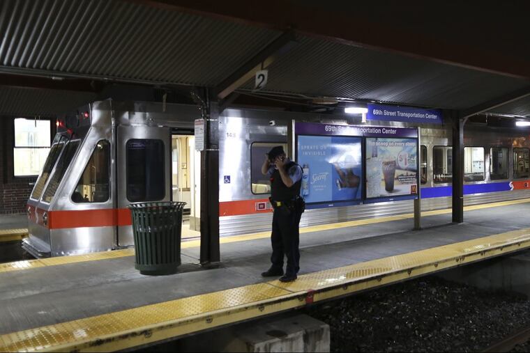 SEPTA officials look over damaged train cars on Tuesday Aug. 22, 2017, at the 69th Street Transportation Center in Upper Darby. According to SEPTA officials, a train from the Norristown High Speed Line arriving at the transportation center shortly after midnight struck an unoccupied train car that was sitting at the station platform, injuring more than two dozen people.