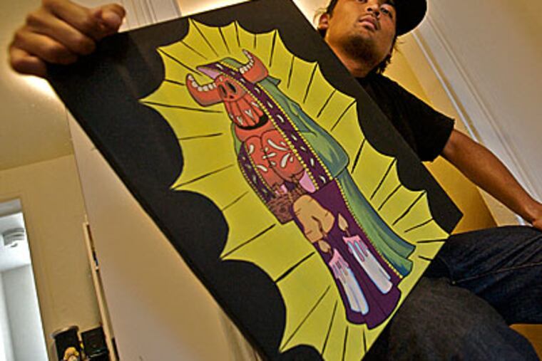 Sticker artist Justin "El Toro" Nagtalon, in South Philly, with his painting "El Toro," a caped mexican boxing bull holding the Liberty Bell. ( John Costello / Staff Photographer )