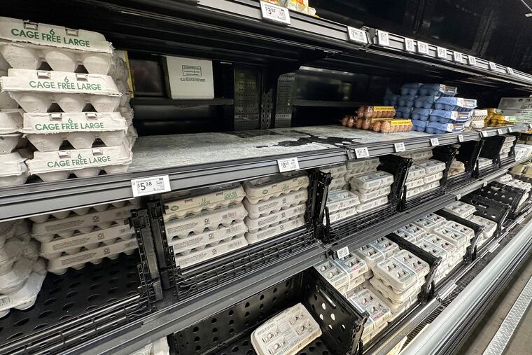 Cartons of eggs sit on a shelf in a Walmart store, March 10, 2025, in Englewood, Colo.