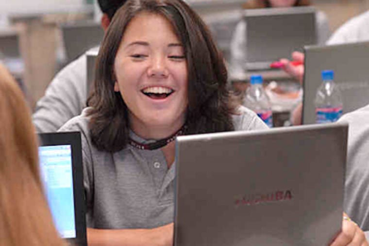 Kaylee Pofahl, 14, follows along on her computer in the Honors English I class. (April Saul / Staff)