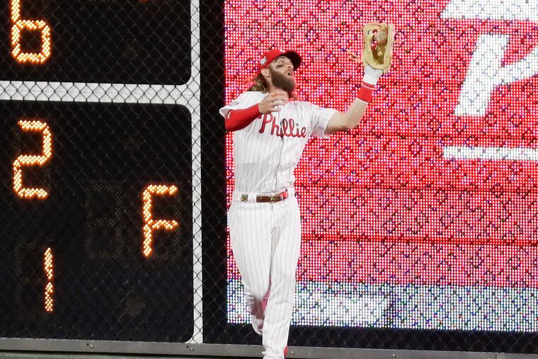 Phillies right fielder Bryce Harper catches Adam Duvall's fourth-inning fly ball.