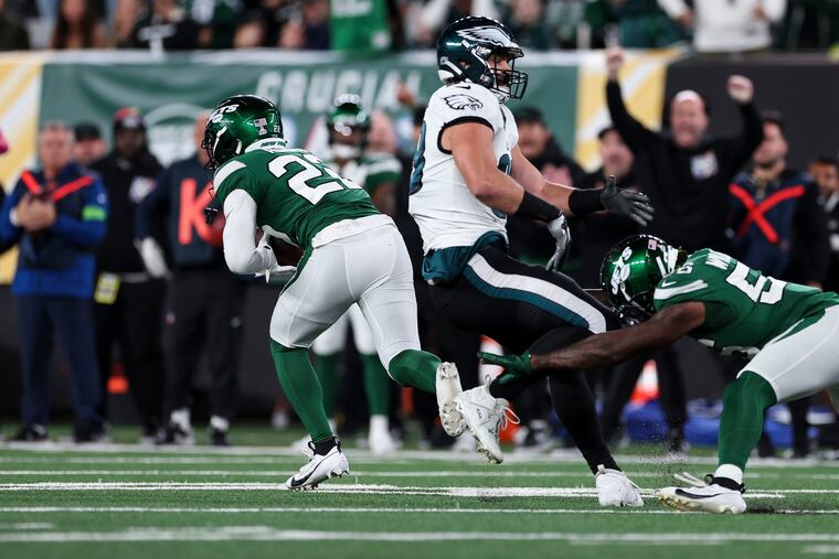 The New York Jets' Tony Adams intercepts a pass from Jalen Hurts during the fourth quarter against the Eagles at MetLife Stadium. Adams returned the interception 45 yards to set up the winning touchdown.