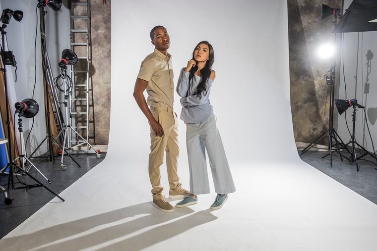 Here Donovan wears a short-sleeved button-down shirt in khaki, Sylvain, $175; flat-front pant in Khami, Jake W, $245, both at Theory.The sneakers: Khaki Nike Air Force One, $150, at Ubiq. Mely Duong. pulls off this blue off-the-shoulder blouse, Ulrika, $235; Capri pant in sky blue, Nadeema, $235, at Theory.The sneakers: Sky blue sneakers, Woman by Common Projects, $449, at Theory. ED HILLE / Staff Photographer