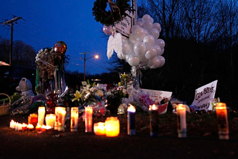 A memorial for shooting victims is on display near Sandy Hook Elementary School in Newtown, Conn. JASON DeCROW / Associated Press