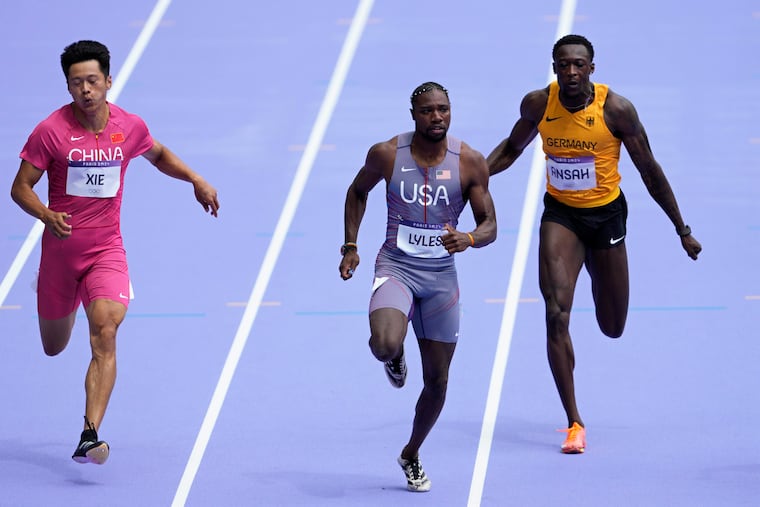 Noah Lyles, of the United States, runs in the men's 100 meter dash qualifying heat the 2024 Summer Olympics Saturday in Saint-Denis, France.