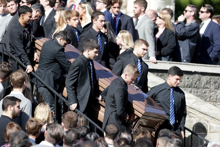 Pallbearers carry the casket out of the church during the funeral for Salvatore DiNubile at Epiphany of Our Lord Church in Philadelphia.