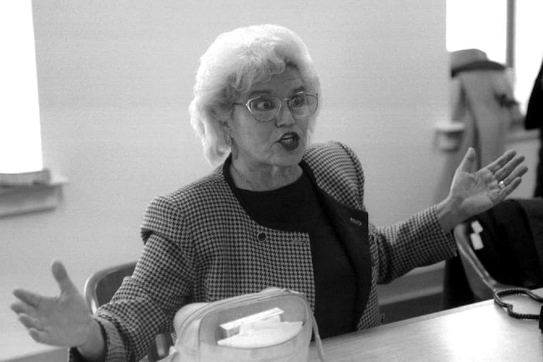 In this Nov. 1993 file photo, ballots are counted in a close election between Bill Stinson and Bruce Marks for a seat in the state senate. Marge Tartaglione, chairman of the election commision, responds to Bruce Marks in a heated exchange, before absentee ballots were counted in the afternoon.