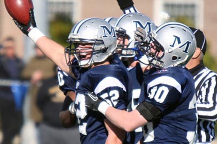 Malvern Prep's Joseph Barrett celebrates with teammates after recovering a fumble. (Lou Rabito / Staff)