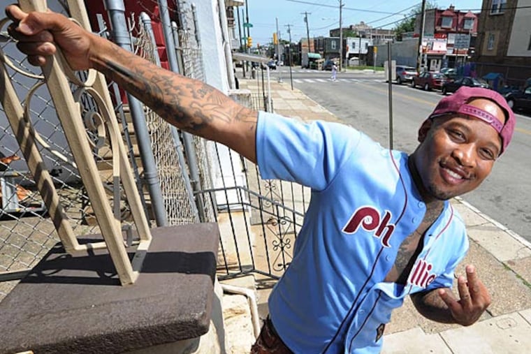 Rapper Mont Brown on South 55th Street, where he is going to throw another block party to promote education, the arts, and small business on Saturday. (Clem Murray/Staff Photographer)