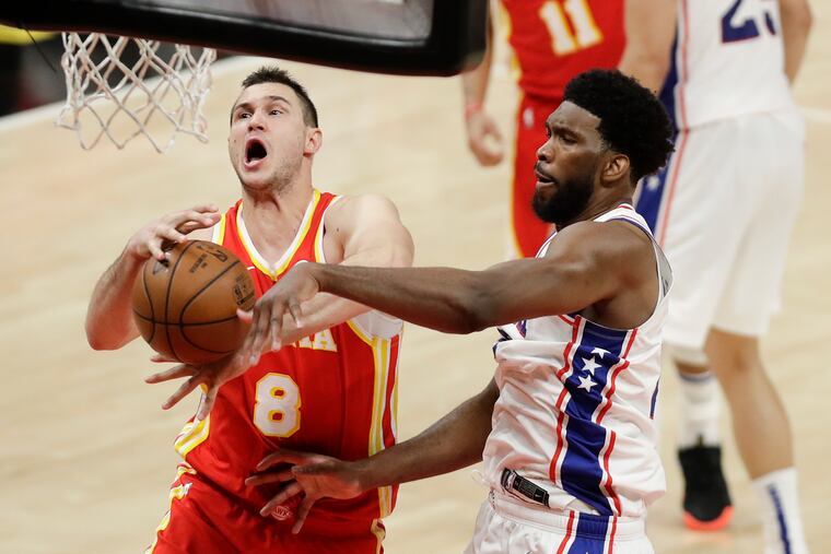 Sixers center Joel Embiid strips the ball from Atlanta's Danilo Gallinari during Game 3 of the NBA Eastern Conference semifinals on Friday, June 11, 2021 in Atlanta.