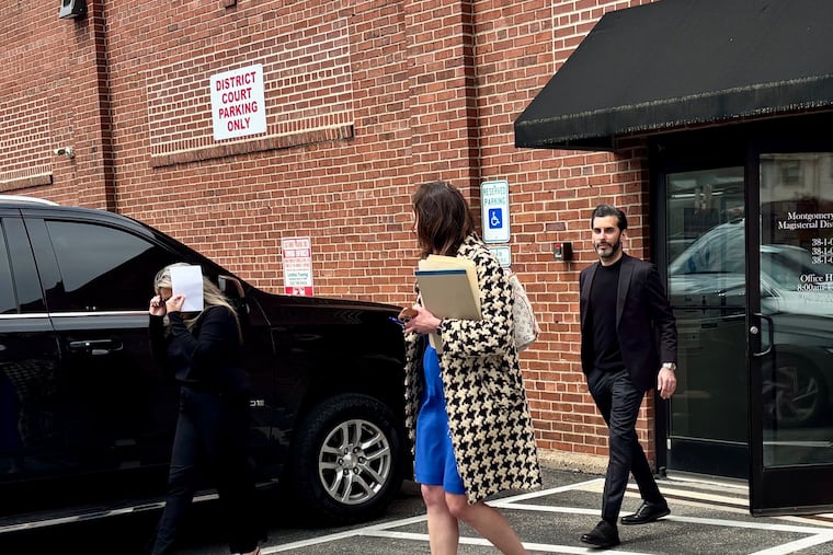 Gina Marks (left) and Steve Nicklas (right) leave district court in Jenkintown on Monday. Two women testified during Nicklas' preliminary hearing that he and Marks stole thousands of dollars from them while promising to cleanse them of black magic.