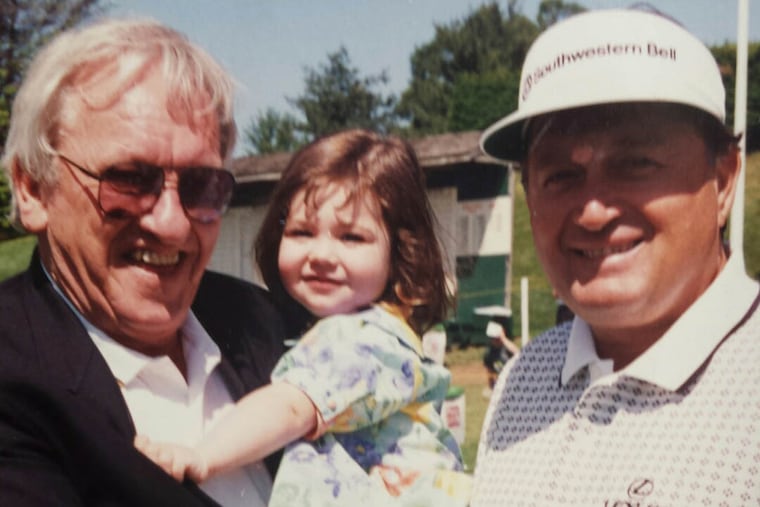 Joseph Braly, left, holding his granddaughter.