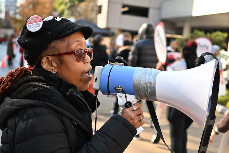 Monica Burks speaks into a bullhorn during a strike outside Wyndham hotel Saturday Nov. 8, 2025. Burks has worked as a server and bartender at the hotel for 17 years.